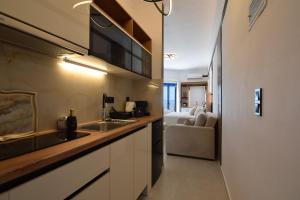 a kitchen with a sink and a counter at Ocean View Rooms in Paralia Vrachou