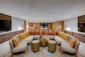 a large living room with a couch and a table at Makkah Hotel in Mecca