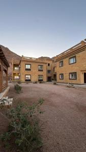 a large brick building with a lot of windows at The Palace Dahab in Dahab
