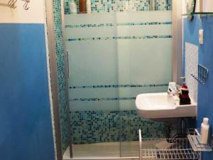 a bathroom with a shower and a sink at Casa alla Rocca in Petritoli