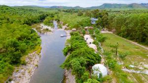an aerial view of a river with a group of boats at Lạc Sanh Onsen Resort in Tuy Hoa