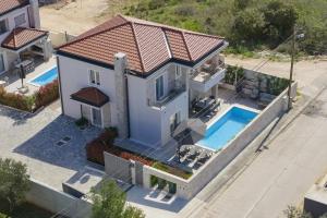 an aerial view of a house with a swimming pool at Casa Coral in Zadar