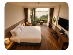 a hotel room with a bed and a balcony at 1404, Building 1, Ocean Sky Forest - Flamingo Cat Ba in Cat Ba +47 photos