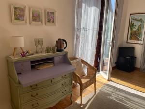 a room with a dresser with a lamp on it at Bed & Breakfast Lujocanda in Casarza Ligure