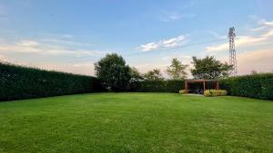 a large lawn with a gazebo in a yard at B&B Il Cormorano in Scardovari