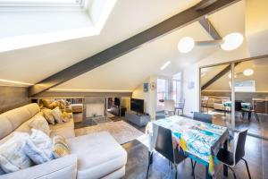 a living room with a couch and a table at Le Princess in Évian-les-Bains +10 photos