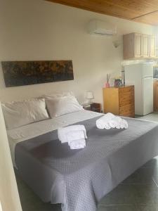 a bedroom with a bed with towels on it at casa l'olivo in Forio d'Ischia