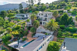 an aerial view of a house with palm trees at Dreamhouse Guest House in Hout Bay
