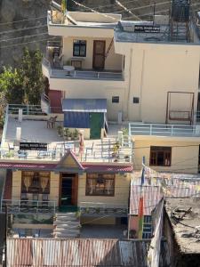 an overhead view of a building with a balcony at Hotel River View in Syābru Bensi +2 photos