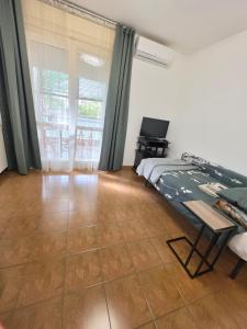 a bedroom with a bed and a television in it at Appartamento Silva in Gorizia