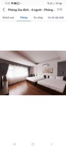 a page of a website with two beds in a bedroom at Tara Hotel & Spa in Hanoi