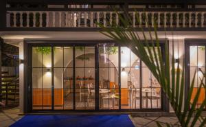 a house with a gate in front of a restaurant at Goan Bliss Alaya Stays by ELIVAAS in Varca +47 photos