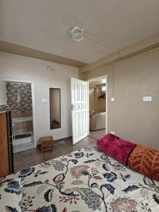 a bedroom with a large bed in a room at Harry's Homestay in Shillong