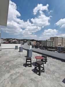 a group of chairs sitting on top of a roof at Harry's Homestay in Shillong