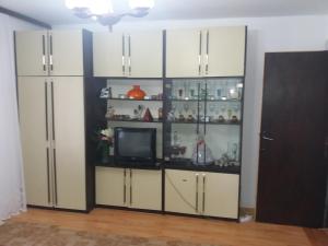 a large white cabinet with a tv in it at Traianov most in Kladovo +14 photos