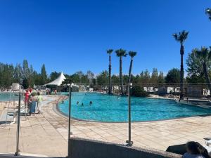 a large swimming pool with people in it at Mobilehome in Vias