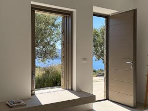 an open door with a view from a house at ARETI Horizon in Kástron