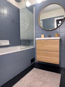 a bathroom with a sink and a mirror at CHATA u BABULŮ in Morávka +34 photos