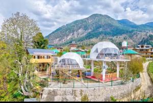 an aerial view of a resort with mountains in the background at Regal Retreat in Jari