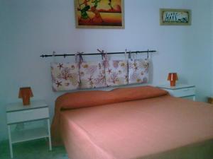 Łóżko lub łóżka w pokoju w obiekcie La casetta 5P
