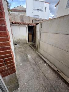 an alley in a building with a wall at LONI Expériences moderne emplacement idéal in Challans