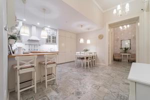 a kitchen and dining room with a table and chairs at Serenity Boutique Budapest in Budapest +19 photos