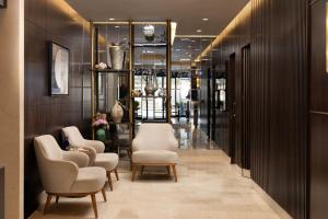 a hallway with chairs and tables in a store at Bentley Hotel Old City-Special Class in Istanbul