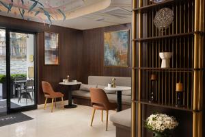 a restaurant with two tables and chairs in a room at Bentley Hotel Old City-Special Class in Istanbul
