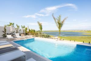 a swimming pool with a view of the water at Villa Cosmo Panorama in Rrashbull
