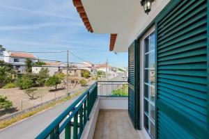 a balcony with a view of a street at Lisbon Coastal Retreat in Charneca
