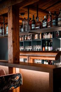 a bar with a lot of bottles of alcohol at Hotel Gierer in Wasserburg