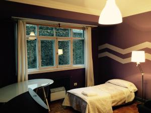 Postel nebo postele na pokoji v ubytování Apartment Lugo Rooms