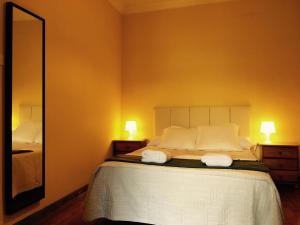 Postel nebo postele na pokoji v ubytování Apartment Lugo Rooms