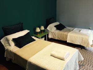 Postel nebo postele na pokoji v ubytování Apartment Lugo Rooms