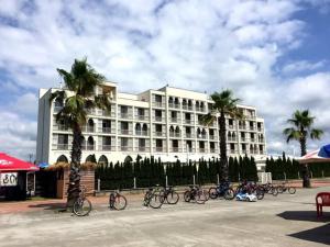 a building with a bunch of bikes parked in front of it at Hotel Anaklia in Zugdidi