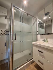 a bathroom with a shower and a sink at Central Studio - Port & Lices walkable - Parking in Saint-Tropez