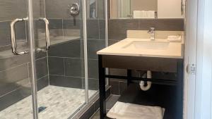 a bathroom with a sink and a shower at Studio 6 Elko, NV in Elko +13 photos