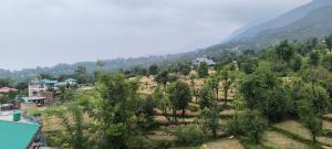 an aerial view of a village in the mountains at Touch wood guest house in Dharmsāla +11 photos