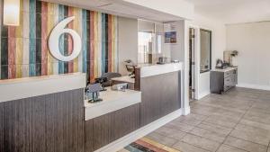 a dermatologists office with a reception desk and a mirror at Studio 6 Elko, NV in Elko