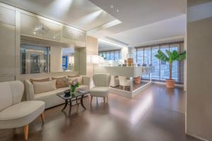 a living room with a couch and a table at Ponte Vecchio Suites & Spa in Florence +81 photos