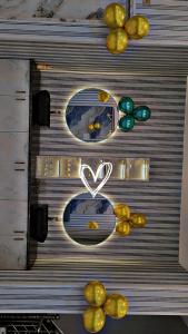 a metal door with two mirrors and a heart on it at sSS HOTEL & RESTURENT in Ahraurā Road