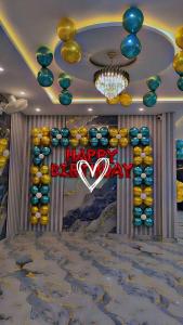 a room with a happy valentines sign on the wall at sSS HOTEL & RESTURENT in Ahraurā Road