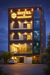 a building with a sign that reads six hotel restaurant at sSS HOTEL & RESTURENT in Ahraurā Road