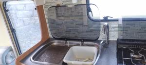 a bathroom with a sink in the middle of it at Peaceful Private Haven in Frongoch +7 photos
