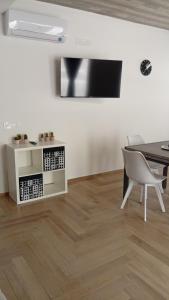a dining room with a table and a table and a chair at Bed and Breakfast inCentro - Pontecagnano in Pontecagnano