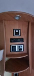 a wooden table with two microwaves on top of it at Peaceful Private Haven in Frongoch