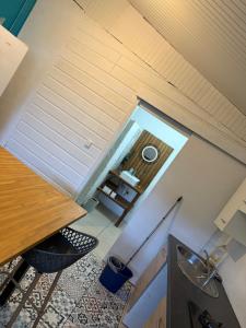 an overhead view of a kitchen with a table and chairs at Kay Yvette in Saint-Pierre +14 photos