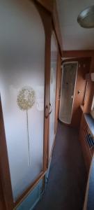 an interior view of an rv with a plant on the wall at Peaceful Private Haven in Frongoch