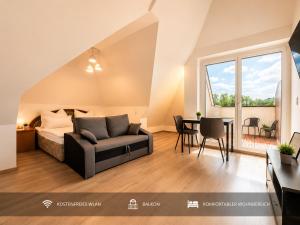 a bedroom with a bed and a table in a room at Ort 245 in Ried im Innkreis