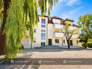 an exterior view of a building with a tree at Ort 245 in Ried im Innkreis